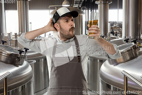 Image of Professional brewer on his own craft alcohol production