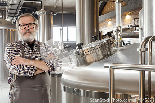 Image of Professional brewer on his own craft alcohol production