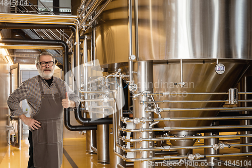 Image of Professional brewer on his own craft alcohol production