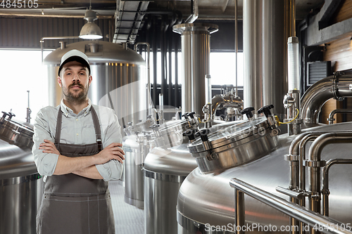 Image of Professional brewer on his own craft alcohol production