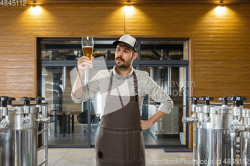 Image of Professional brewer on his own craft alcohol production