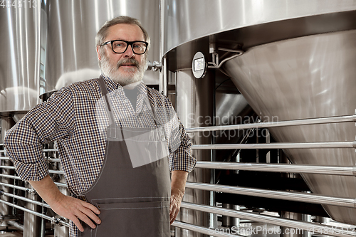 Image of Professional brewer on his own craft alcohol production