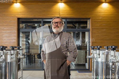 Image of Professional brewer on his own craft alcohol production