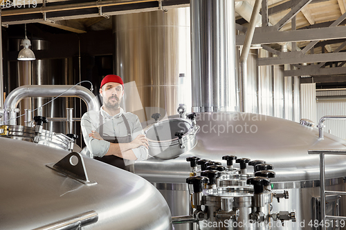 Image of Professional brewer on his own craft alcohol production