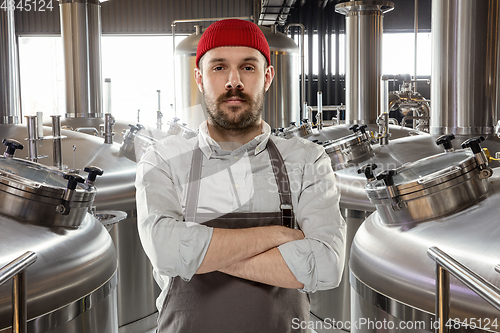 Image of Professional brewer on his own craft alcohol production