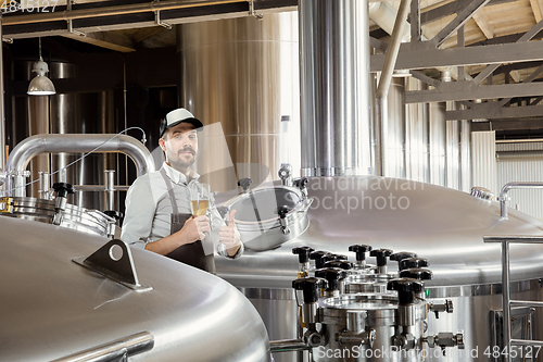 Image of Professional brewer on his own craft alcohol production