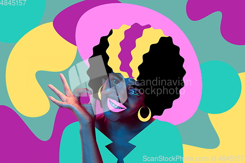 Image of Portrait of a beautiful young woman with bright colorful painted design