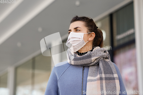 Image of young woman wearing protective medical mask