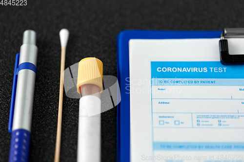 Image of medical report, test tube, cotton swab and pen