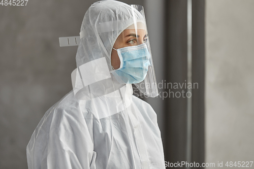 Image of doctor in protective wear, mask and face shield