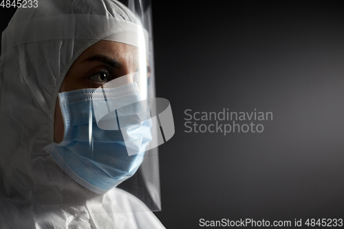 Image of doctor in protective wear, mask and face shield