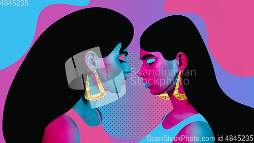 Image of Portrait of a beautiful young woman with bright colorful painted design