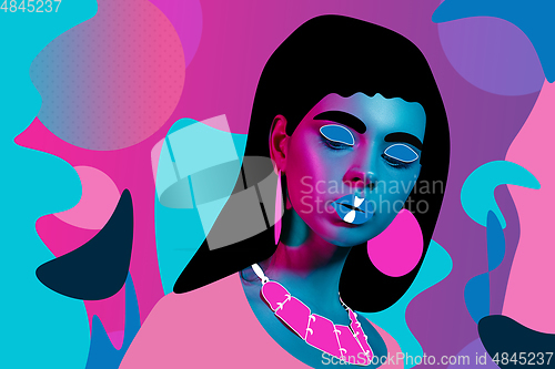Image of Portrait of a beautiful young woman with bright colorful painted design
