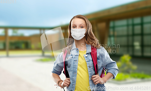 Image of teenage student girl in mask with school bag