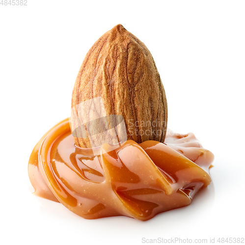 Image of almond in melted caramel