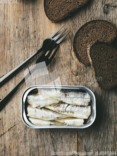 Image of open sardines can