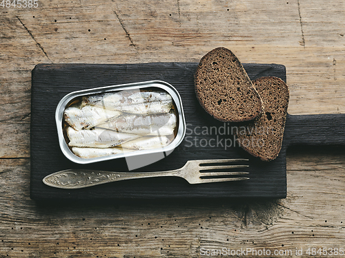 Image of open sardines can