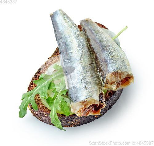 Image of canned sardine on bread slice