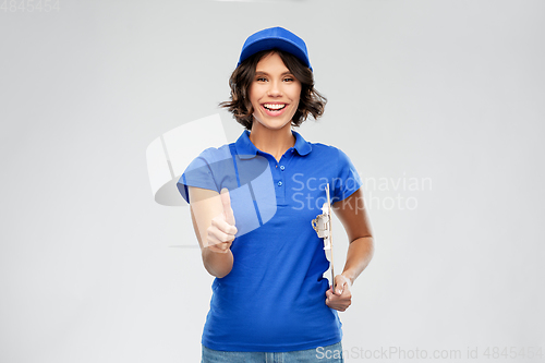 Image of happy smiling delivery girl with clipboard