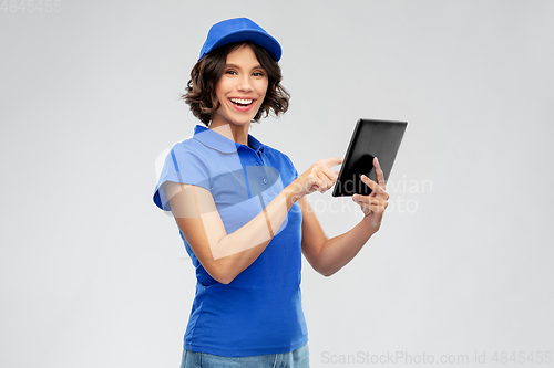 Image of happy smiling delivery girl with tablet computer