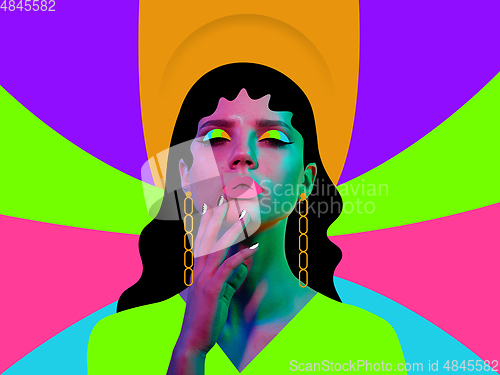 Image of Portrait of a beautiful young woman with bright colorful painted design