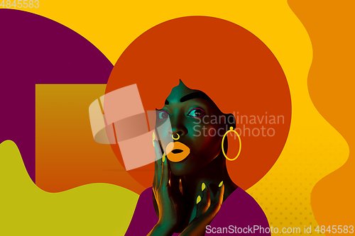 Image of Portrait of a beautiful young woman with bright colorful painted design