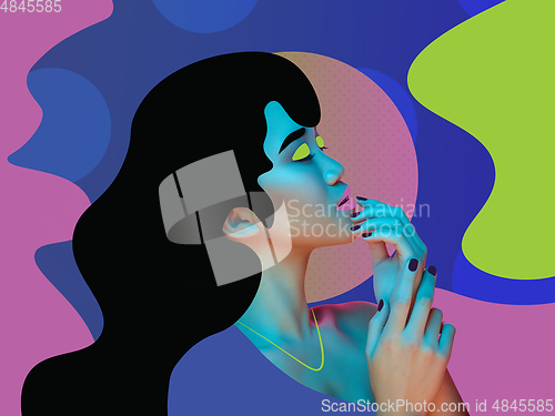 Image of Portrait of a beautiful young woman with bright colorful painted design