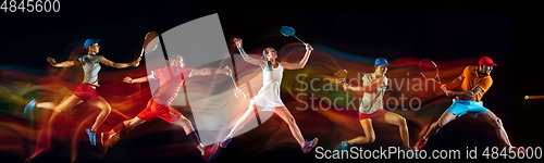 Image of Creative collage of sportsmen in mixed and neon light on black background, flyer, motion and action