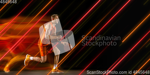 Image of Creative sport and neon lines on dark background, flyer, proposal