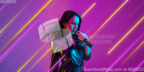 Image of Creative emotions and neon lines on purple background, flyer, proposal