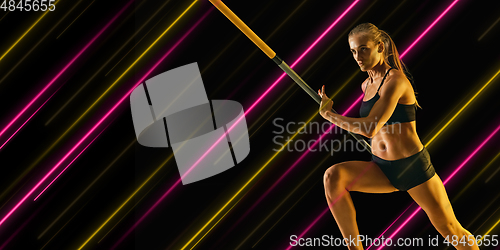 Image of Creative sport and neon lines on dark background, flyer, proposal