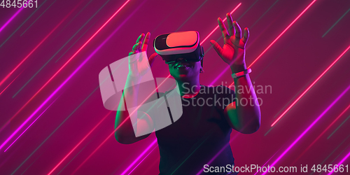 Image of Creative emotions and neon lines on pink background, flyer, proposal