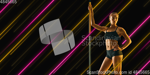 Image of Creative sport and neon lines on dark background, flyer, proposal