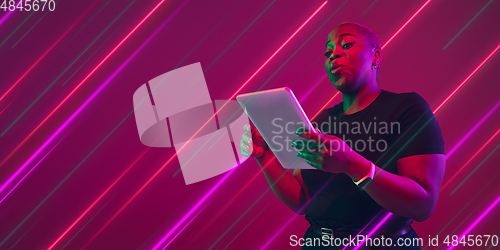 Image of Creative emotions and neon lines on pink background, flyer, proposal