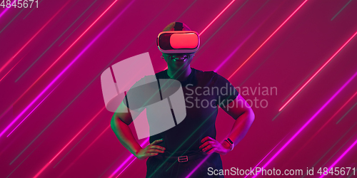 Image of Creative emotions and neon lines on pink background, flyer, proposal