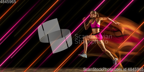 Image of Creative sport and neon lines on dark background, flyer, proposal