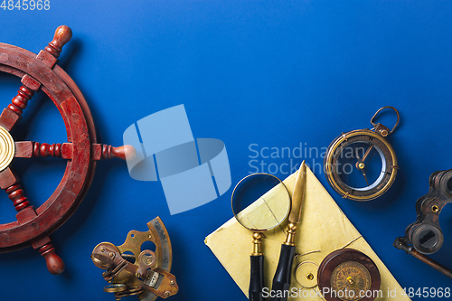 Image of Old fashioned flat lay with retro accessories on blue background
