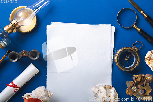 Image of Old fashioned flat lay with retro accessories on blue background