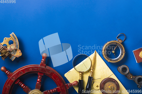 Image of Old fashioned flat lay with retro accessories on blue background