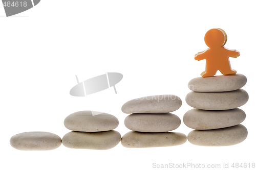 Image of Figurine on stack of pebbles