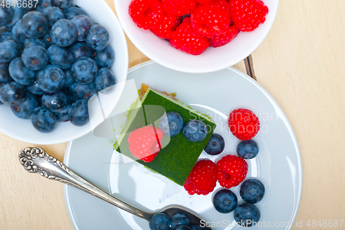 Image of green tea matcha mousse cake with berries