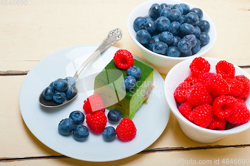 Image of green tea matcha mousse cake with berries