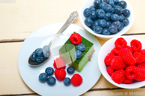 Image of green tea matcha mousse cake with berries