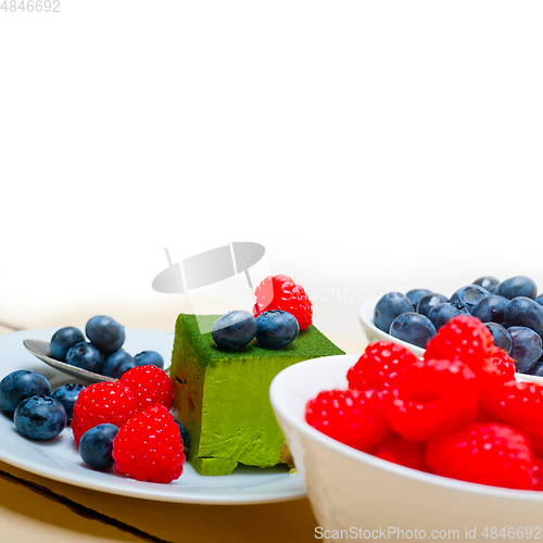 Image of green tea matcha mousse cake with berries