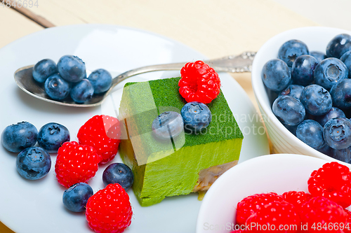 Image of green tea matcha mousse cake with berries