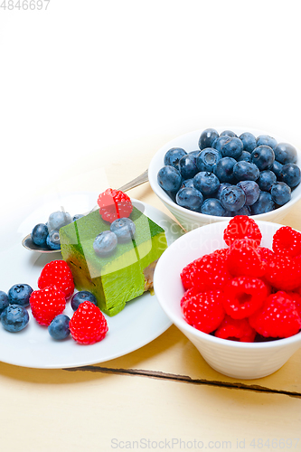 Image of green tea matcha mousse cake with berries