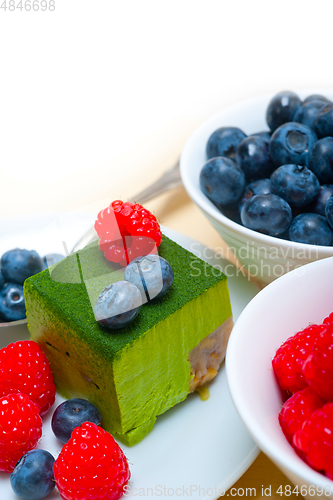 Image of green tea matcha mousse cake with berries