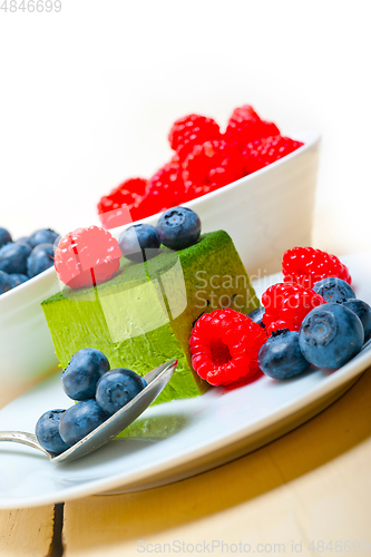 Image of green tea matcha mousse cake with berries