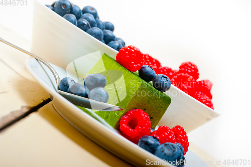 Image of green tea matcha mousse cake with berries