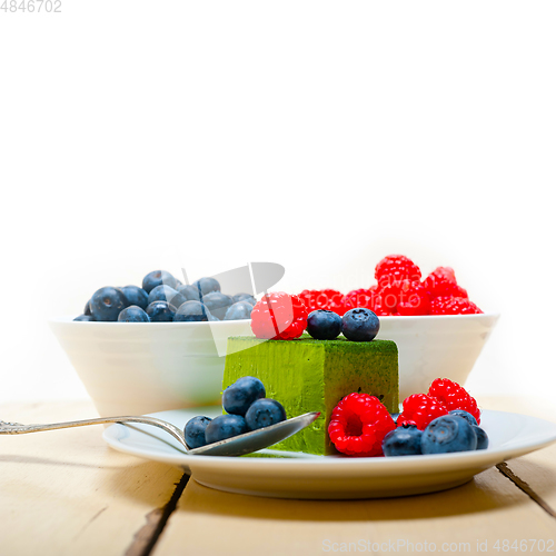 Image of green tea matcha mousse cake with berries